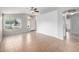 A bright and airy living room offers large windows, tile floors, and neutral paint at 3713 W Nancy Ln, Phoenix, AZ 85041
