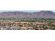 Scenic view of a peaceful neighborhood nestled against a backdrop of majestic mountains at 3713 W Nancy Ln, Phoenix, AZ 85041