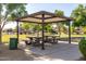 Shaded picnic area offers a refreshing spot to relax and enjoy outdoor meals in a green setting at 3713 W Nancy Ln, Phoenix, AZ 85041