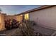 Desert landscaped side yard with gravel, cacti, and privacy wall for low-maintenance appeal at 3713 W Nancy Ln, Phoenix, AZ 85041