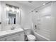 A bathroom featuring an all-white design, shower-tub combination and updated vanity at 3801 E Captain Dreyfus Ave, Phoenix, AZ 85032