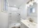 Modern bathroom features a shower and sleek vanity with a decorative mirror at 3801 E Captain Dreyfus Ave, Phoenix, AZ 85032