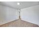 A spacious bedroom with plush carpeting and a view into the hallway at 3801 E Captain Dreyfus Ave, Phoenix, AZ 85032