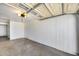 An empty two car garage with painted walls, an automatic door, and plenty of space at 3801 E Captain Dreyfus Ave, Phoenix, AZ 85032