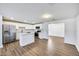 Updated kitchen with white cabinets, stainless steel appliances, and a center island at 3801 E Captain Dreyfus Ave, Phoenix, AZ 85032
