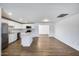 Bright kitchen featuring white cabinets, stainless steel appliances, and a center island at 3801 E Captain Dreyfus Ave, Phoenix, AZ 85032