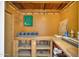 A spacious unfinished storage room with a work bench, peg board, and shelving at 3801 E Captain Dreyfus Ave, Phoenix, AZ 85032