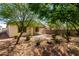Well-maintained backyard with desert landscaping offering easy maintenance and a peaceful outdoor setting at 40066 W Jenna Ln, Maricopa, AZ 85138