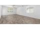 Bright bedroom features a ceiling fan and ample natural light from a large window at 40066 W Jenna Ln, Maricopa, AZ 85138