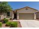 Charming single-story home with a well-kept lawn and a two-car garage, providing comfort and curb appeal at 40066 W Jenna Ln, Maricopa, AZ 85138