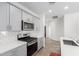 Modern kitchen with quartz countertops, stainless steel appliances, and subway tile backsplash at 40066 W Jenna Ln, Maricopa, AZ 85138