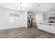 Modern kitchen with stainless steel appliances, quartz counters, and a center island at 40066 W Jenna Ln, Maricopa, AZ 85138