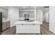 Kitchen with a large island, quartz counters, gray cabinets and modern appliances at 40066 W Jenna Ln, Maricopa, AZ 85138