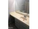 Bathroom featuring a large vanity with a white sink and faucet and a shower/tub at 4042 E Carson Rd, Phoenix, AZ 85042