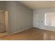 Comfortable bedroom featuring hardwood floors, neutral paint, and a well-lit window at 4042 E Carson Rd, Phoenix, AZ 85042
