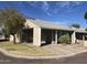 View of a well-maintained home showcasing desert landscaping, covered parking, and a clear, sunny sky at 4042 E Carson Rd, Phoenix, AZ 85042