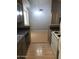 Open kitchen offers light wood flooring and bar seating with views into the dining area at 4042 E Carson Rd, Phoenix, AZ 85042