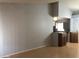 A bright living room featuring neutral walls, hardwood floors, and an open view of the kitchen at 4042 E Carson Rd, Phoenix, AZ 85042