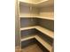 A walk-in pantry featuring multiple shelves for maximum storage capacity at 4042 E Carson Rd, Phoenix, AZ 85042