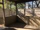 Covered patio with a screened enclosure and a wooden fence surrounding the yard at 4042 E Carson Rd, Phoenix, AZ 85042