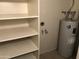 Ample storage space with shelving and a water heater at 4042 E Carson Rd, Phoenix, AZ 85042