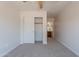 Bright bedroom featuring a closet and an en-suite bathroom for added convenience at 41767 W Somerset Dr, Maricopa, AZ 85138