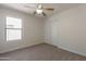 Well-lit bedroom with a window and closet, offering comfortable living space at 41767 W Somerset Dr, Maricopa, AZ 85138