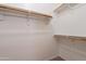 Walk-in closet with simple shelving to maximize storage at 41767 W Somerset Dr, Maricopa, AZ 85138
