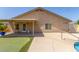 Backyard features a pool, putting green, and covered patio at 4307 E Shetland Dr, San Tan Valley, AZ 85140