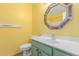 Bright bathroom features a colorful mirror, and mint vanity at 4307 E Shetland Dr, San Tan Valley, AZ 85140