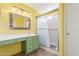 Bright bathroom featuring a tiled shower, designer mirror, and cabinets at 4307 E Shetland Dr, San Tan Valley, AZ 85140