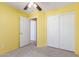 Bedroom with white sliding door closet, neutral carpet, and ceiling fan at 4307 E Shetland Dr, San Tan Valley, AZ 85140
