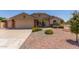 Charming single-story home with a well-manicured front yard and a two-car garage at 4307 E Shetland Dr, San Tan Valley, AZ 85140