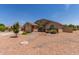 Exterior of a single-story home with desert landscaping and a well-maintained lawn at 4307 E Shetland Dr, San Tan Valley, AZ 85140