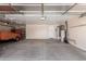 Spacious two-car garage with water heater, door to backyard, and storage at 4307 E Shetland Dr, San Tan Valley, AZ 85140