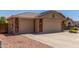 Spacious two-car garage with brick accents and a concrete driveway at 4307 E Shetland Dr, San Tan Valley, AZ 85140
