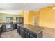 Spacious kitchen showcasing a dark island and black appliances at 4307 E Shetland Dr, San Tan Valley, AZ 85140