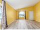 Bright living room with wood floors, yellow walls, and a large window at 4307 E Shetland Dr, San Tan Valley, AZ 85140