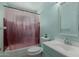 Bathroom featuring a shower-tub combo, toilet, and sink with medicine cabinet at 4501 W Crittenden Ln, Phoenix, AZ 85031