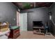 Bedroom with dark walls and ceiling, tile floors and a dresser at 4501 W Crittenden Ln, Phoenix, AZ 85031