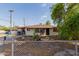 Charming single-story home with desert landscaping and chain link fence at 4501 W Crittenden Ln, Phoenix, AZ 85031