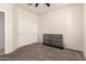 Carpeted bedroom features new dresser with window and a ceiling fan at 5039 S 237Th Ln, Buckeye, AZ 85326