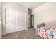 Bedroom with carpet, closet and door to another room at 5039 S 237Th Ln, Buckeye, AZ 85326