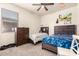 Bedroom featuring twin beds, carpet, window and a ceiling fan at 5039 S 237Th Ln, Buckeye, AZ 85326