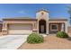 Charming single-story home with a neutral color scheme, desert landscaping, and a covered porch at 5039 S 237Th Ln, Buckeye, AZ 85326