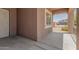 Covered front porch featuring decorative railings and views of the desert landscaped front yard at 5039 S 237Th Ln, Buckeye, AZ 85326