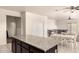 Spacious kitchen with island, granite countertops, and open floor plan, ideal for cooking and entertaining at 5039 S 237Th Ln, Buckeye, AZ 85326