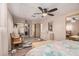 Airy bedroom featuring a neutral color scheme, ceiling fan, and ample natural light from the windows at 506 S 81St Pl, Mesa, AZ 85208