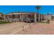 Inviting single-story home with covered parking, landscaped yard, and desert surroundings at 506 S 81St Pl, Mesa, AZ 85208