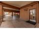 Fitness room entrance with bike parked to the side and visible outdoor access at 506 S 81St Pl, Mesa, AZ 85208